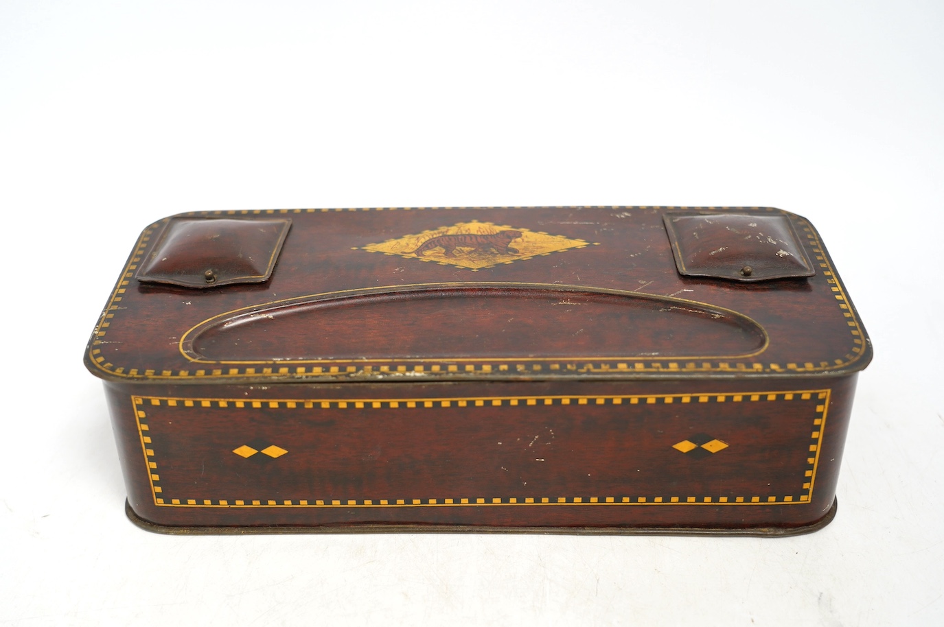 An early 20th century Carrs novelty 'dice game' biscuit tin, a Don Confectionery 'chessboard' tin and a Wright & Son Ltd inkstand tin, largest 33cm wide. Condition - fair